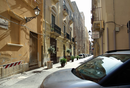ITALY, TRAPANI-25 OCTOBER: Trapani is a city on the west coast of Sicily. View of the narrow street in Trapani on October 25, 2022, Trapani, Sicily.のeditorial素材