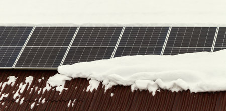 Solar panels on the roof in a winter time.の写真素材
