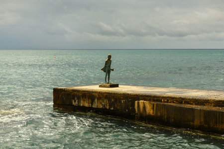 CYPRUS, PAPHOS-18 MARCH:Paphos is a coastal city in southwest Cyprus, lies on the Mediterranean coast. View of the sculpture of fishboy on 18 March 2023, Cyprus, Paphos.のeditorial素材