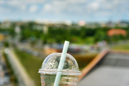 A bottle with a straw on top.の写真素材