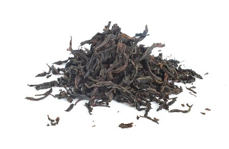 Heap of dried green tea on white backgroundの写真素材