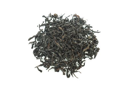Heap of dried green tea on white backgroundの写真素材