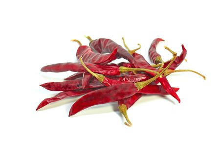dried chili peppers on white backgroundの写真素材