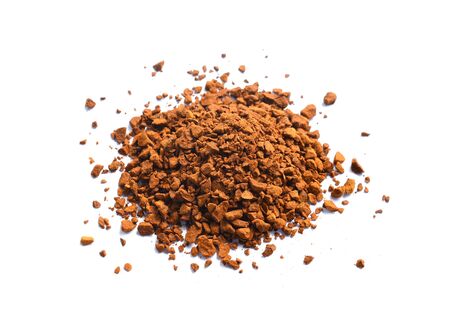 instant coffee grains isolated on white backgroundの写真素材
