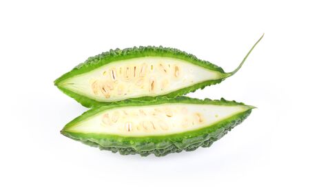 Bitter melon or Bitter gourd with half sliced isolated on white backgroundの写真素材