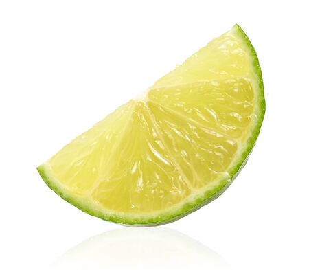 Ripe slice of green lime citrus fruit stand isolated on white background.の写真素材