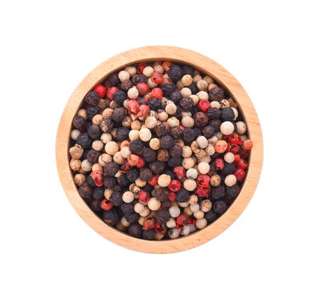 Mixed of peppers hot, red, black, white in wood bowl on white background.の写真素材