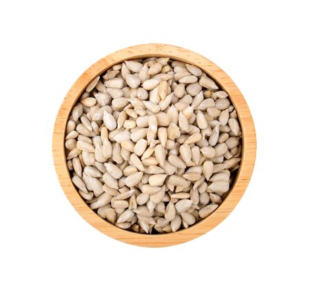 sunflower seeds in bowl on white background.の写真素材