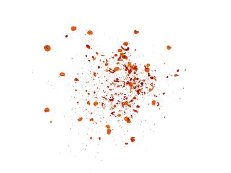 pile crushed red cayenne pepper, dried chili flakes and seeds on white background.の写真素材