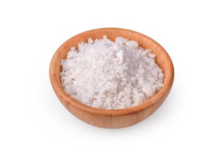 salt in a wooden bowl on white background.の写真素材