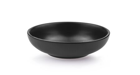 Black ceramic bowl isolated on white background.の写真素材