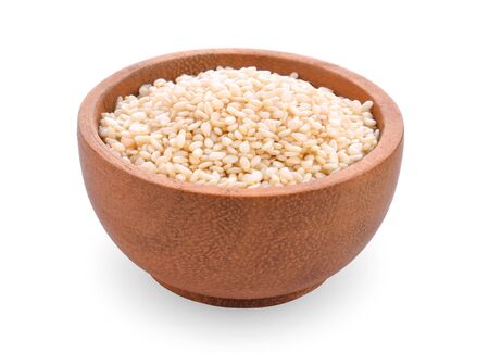 White sesame in wooden bowl on white background.の写真素材