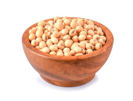 Soybeans in wooden bowl on white background.の写真素材