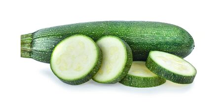 fresh green zucchini with slice isolated on white backgroundの写真素材