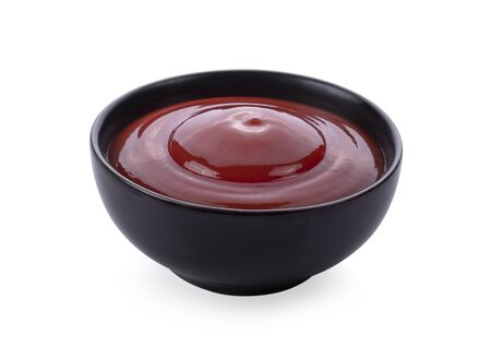 tomato sauce in a bowl on white background.の写真素材