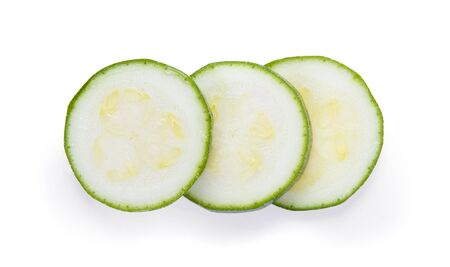 Sliced zucchini isolated on white background, top viewの写真素材