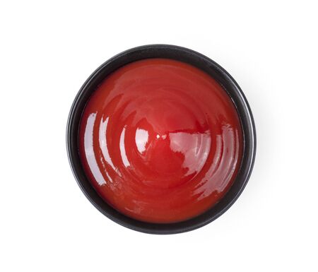 tomato sauce in a bowl on white background.の写真素材