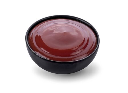 tomato sauce in a bowl on white background.の写真素材