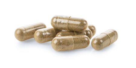Herb capsules isolated on white background.の写真素材