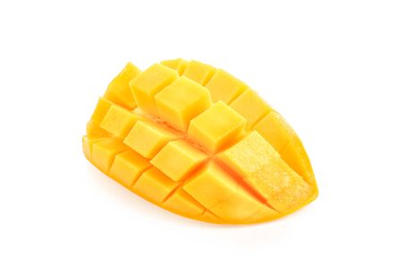 Ripe yellow Mangoes cut half in cubes isolated on white background.の写真素材