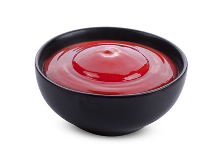 tomato sauce in a bowl on white background.の写真素材