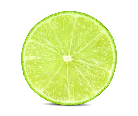Juicy slice of lime isolated on whiteの写真素材