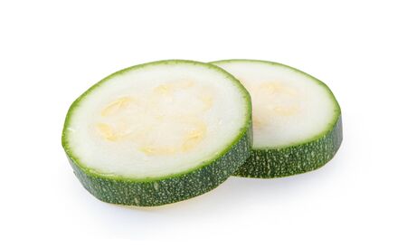 fresh green zucchini  slice isolated on white background.の写真素材