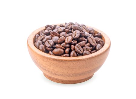 Coffee beans in wooden bowl isolated on white background.の写真素材