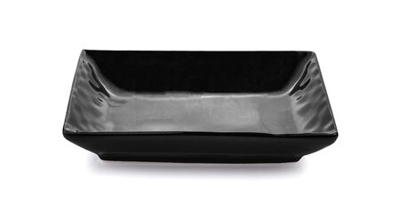black plate ceramic on white background.の写真素材