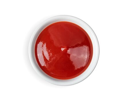 tomato sauce in a bowl on white background.の写真素材