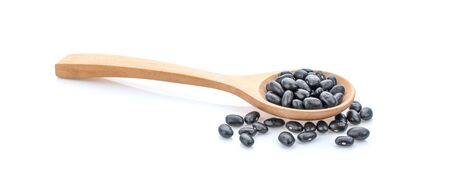 black bean in wooden spoon on white background.の写真素材