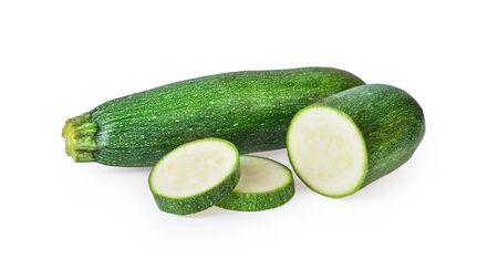 fresh green zucchini with slice isolated on white backgroundの写真素材