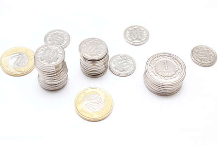 Stacks of coins on white background の写真素材