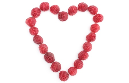 Heart of raspberries isolated on white background