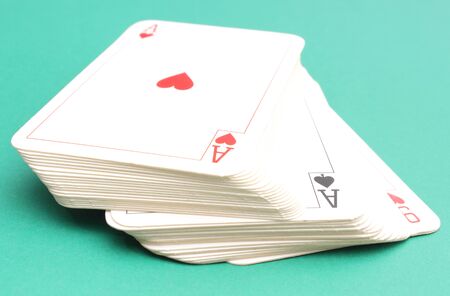 Composition of game cards isolated on green backgroundの写真素材