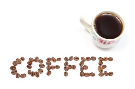 Inscription coffee and cup of beverage on white background, word coffee with coffee grains and copy space for text  White backgroundの写真素材
