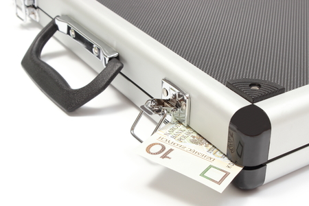 Suitcase with polish banknote, suitcase with currency  Isolated on white backgroundの写真素材
