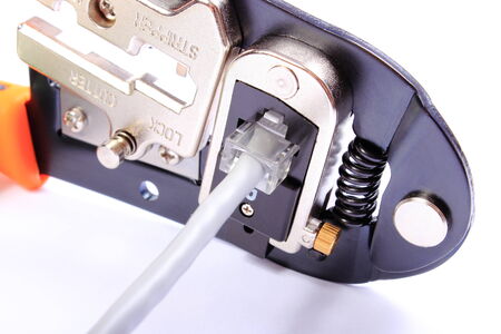 Professional tool for engineering jobs, patch cable with plug. Isolated white background