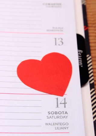 Red heart for valentines on calendar, detail and concept for valentines dayの写真素材