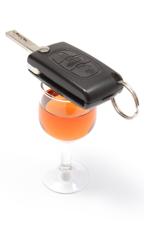 Closeup of key car lying on glass of wine, key car and alcohol, donの写真素材