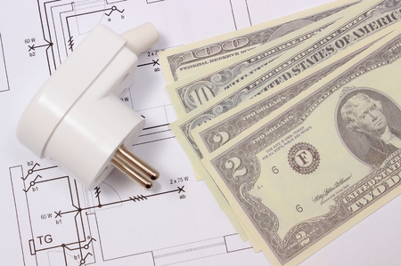 Electric plug and money on electrical construction drawing of house, accessories for engineering...
