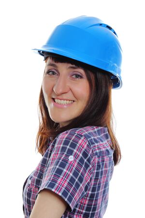 Smiling female construction worker wearing protective blue helmet, industrial worker woman, safety at work. Isolated on white backgroundの写真素材