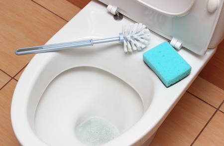 Accessories for cleaning on toilet bowl, concept for house cleaning and household dutiesの写真素材
