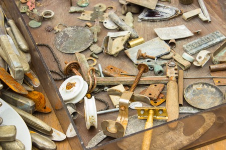 Heap of antique old rusty things and tools for sale on stall at the bazaarの写真素材