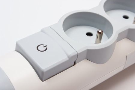 Electrical power strip with switch on-off on white background, electrical extension, power board