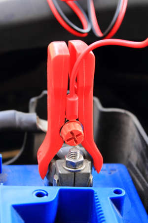 Charger with cables uses to charge old dead car batteryの写真素材