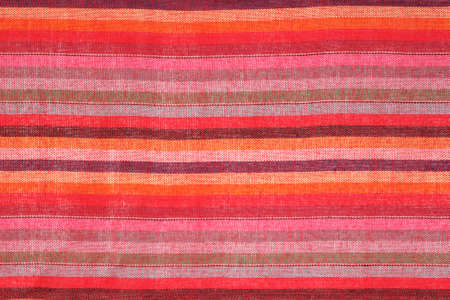 Colorful striped shawl scarf as background texture, multicolored fabric as backdropの写真素材