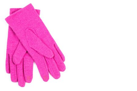Pair of woolen gloves for woman on white background, copy space for text, womanly accessories, warm clothing for autumn or winterの写真素材
