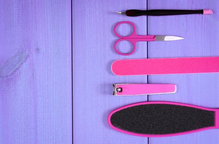 Accessories for manicure or pedicure, nail file, scraper, scissors, nail clippers, concept of nail, hand and foot care, copy space for text or inscriptionの写真素材