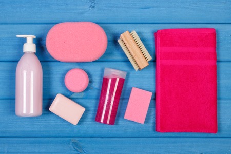 Cosmetics and accessories for personal hygiene in bathroom, soap, body scrub, towel, sponge, brush, pumice, concept of body careの写真素材